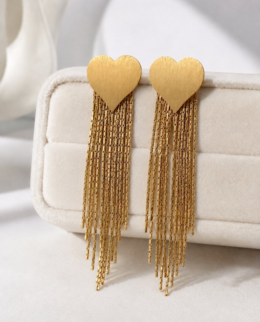 Amora Heart Tassel Earrings on display