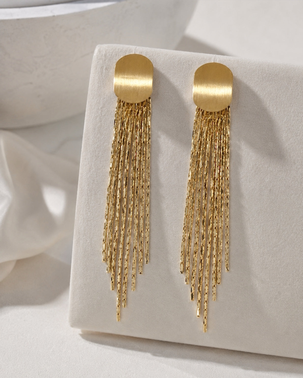 Sera Tassel Earrings on display